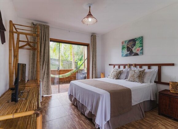 Suíte Duplo Standard – Harmonia e Conforto com Vista para o Jardim