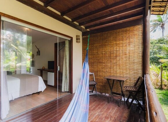 Suíte Duplo com Cama Extra – Espaço, Natureza e Conforto para até 4 Pessoas