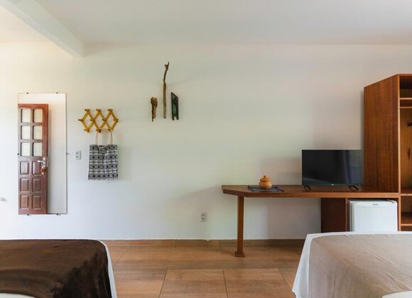 Suíte Duplo com Cama Extra – Espaço, Natureza e Conforto para até 4 Pessoas
