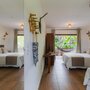 Suíte Duplo com Cama Extra – Espaço, Natureza e Conforto para até 4 Pessoas